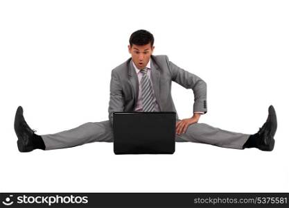 Man sitting on the floor with his laptop