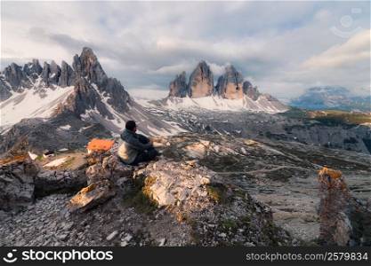 Man sitting on the mountain hill