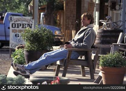 Man Sitting on the Porch