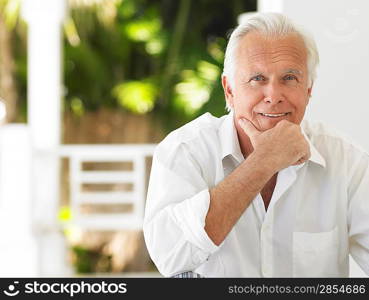 Man sitting on verandah portrait