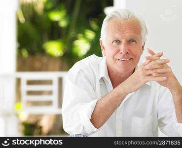 Man sitting on verandah portrait