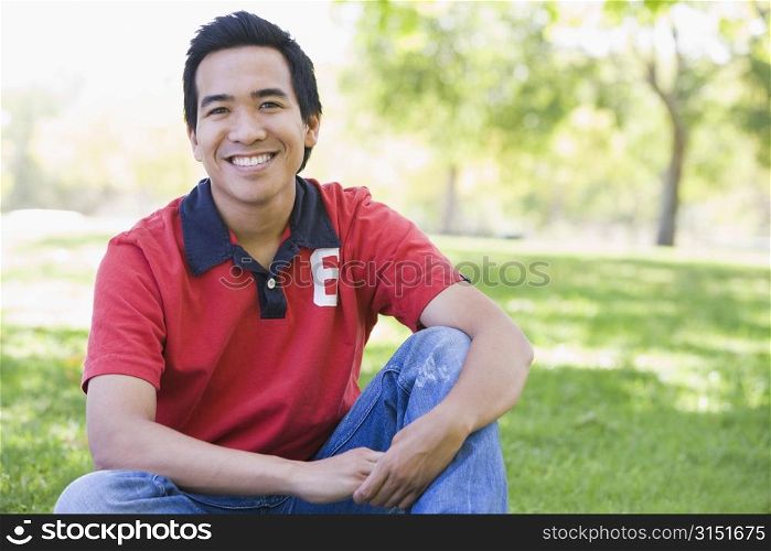 Man sitting outdoors smiling
