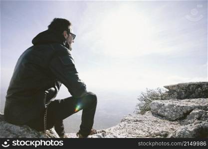 man sitting rock