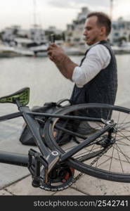 man sitting taking his bike