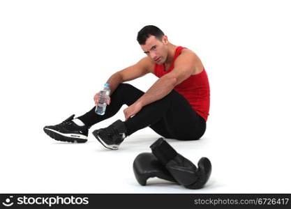 Man sitting with boxing gloves