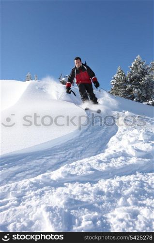 Man skiing downhill