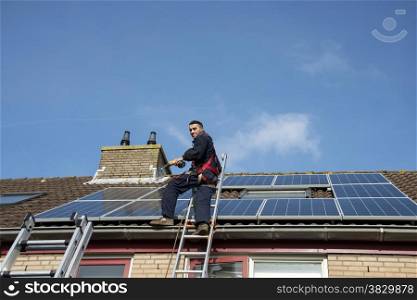 man smiling and happy with construction of solar panels
