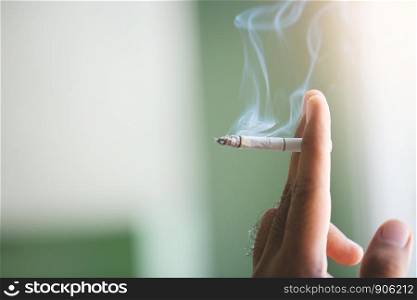 man smoking a cigarette. Cigarette smoke spread.