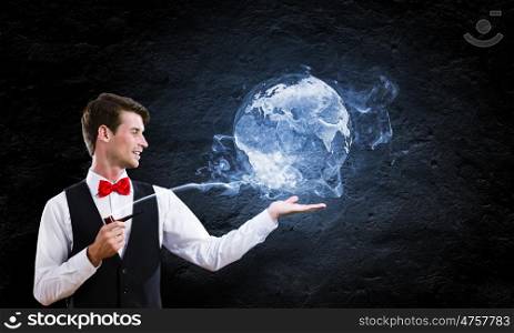 Man smoking pipe. Young handsome businessman in fumes smoking pipe