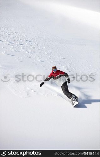 Man snowboarding alone