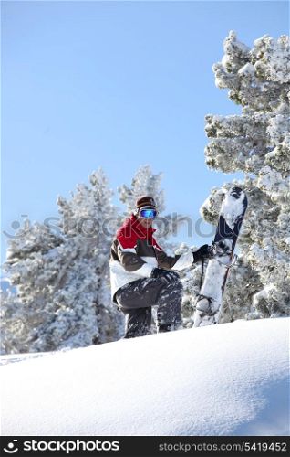Man snowboarding down snowy hill