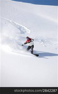 Man snowboarding on isolated piste