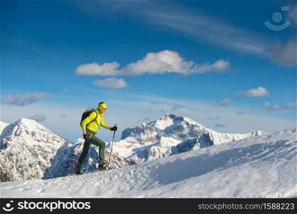 Man snowshoeing in mountain site