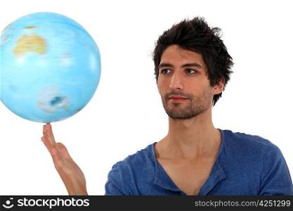Man spinning a globe