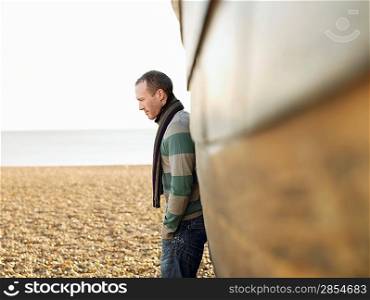 Man Standing Alone on Beach