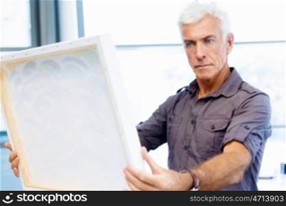 Man standing in a gallery and contemplating artwork. Man standing in a gallery and contemplating abstract artwork