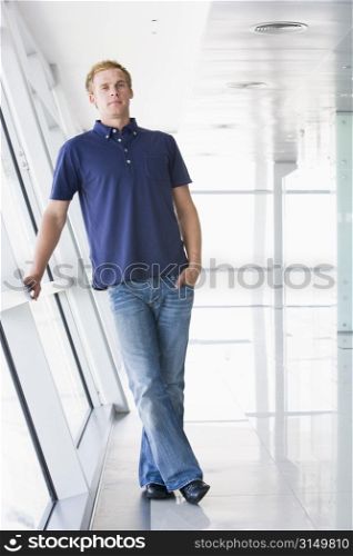 Man standing in corridor