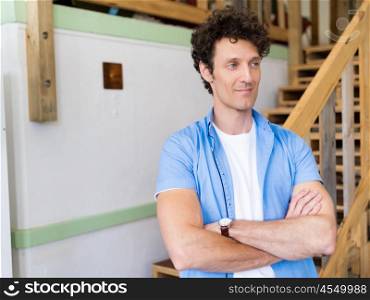 Man standing next to stairs in office