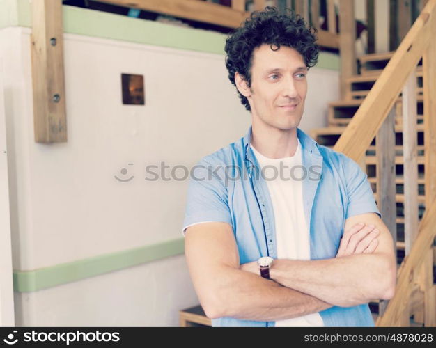Man standing next to stairs in office