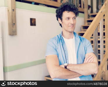 Man standing next to stairs in office