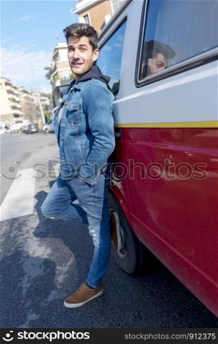 Man standing next to van