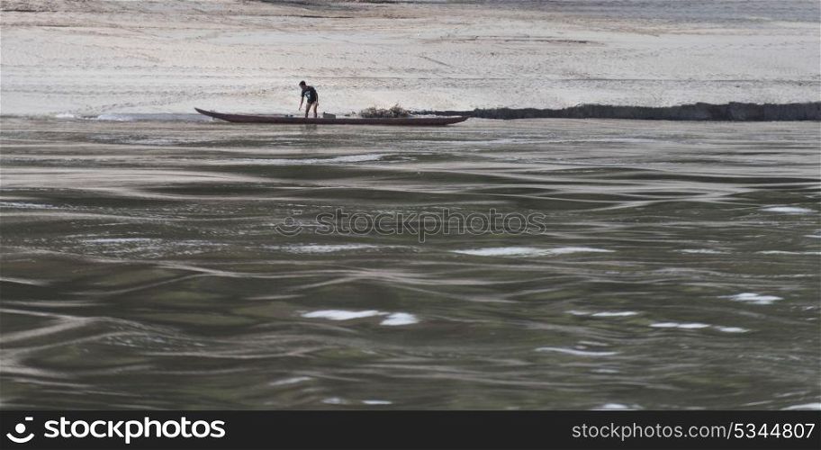 Man standing on boat in River Mekong, Sainyabuli Province, Laos