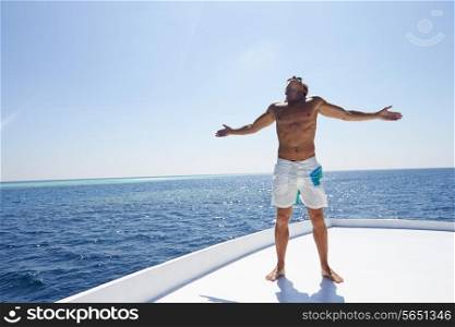 Man Standing On Deck Of Boat