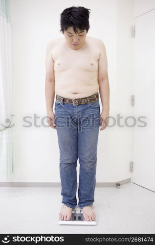 Man standing on scales