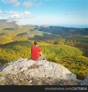 Man standing on the cliff. Conceptual scene. Mountain nature composition.