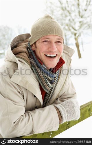 Man Standing Outside In Snowy Landscape