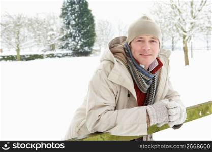Man Standing Outside In Snowy Landscape
