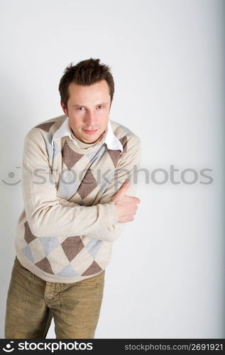 Man standing with arms crossed, portrait