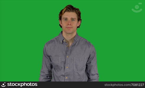 Man stands facing camera (Green Key)