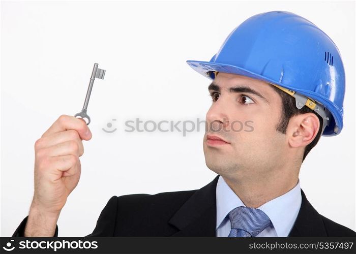 Man staring at a key