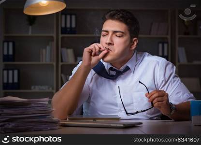 Man staying late at night and smoking marijuana