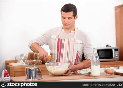 Man stirring mixture in bowl