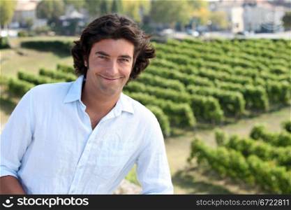 Man stood by vineyard