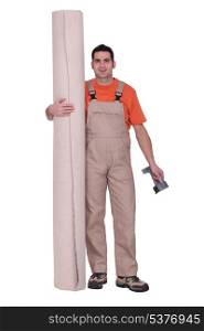 Man stood with carpet roll