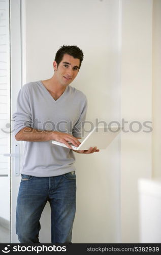 Man stood with portable computer