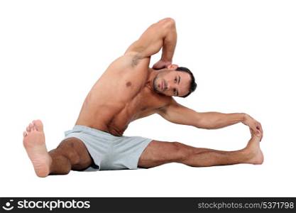 Man stretching on the floor