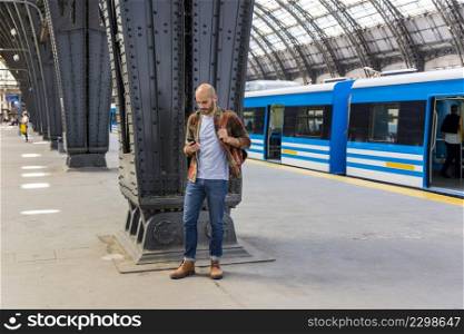 man subway using smartphone