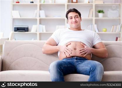 Man suffering from extra weight in diet concept