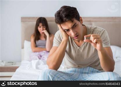 Man suffering from impotency with pill