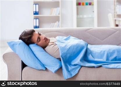 Man suffering from insonmia in bed at home