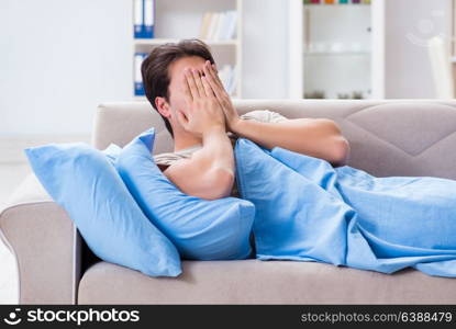 Man suffering from insonmia in bed at home