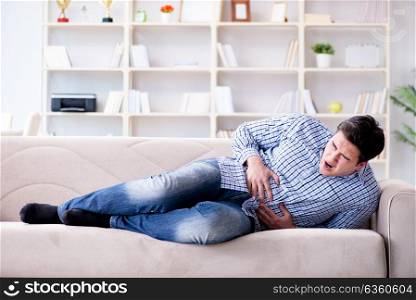 Man suffering from pain at home
