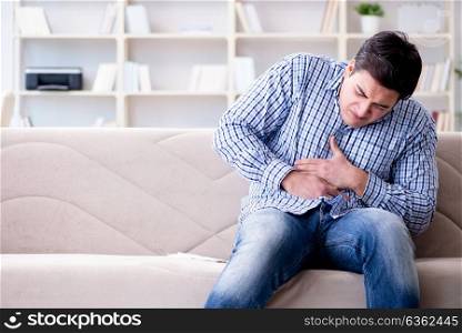 Man suffering from pain at home