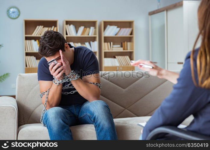 Man suffering from phone dependence visiting doctor