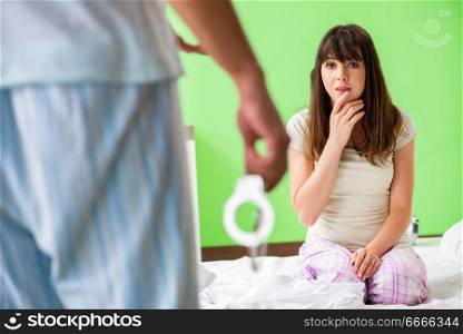 Man suggesting wife to play sexual games with cuffs