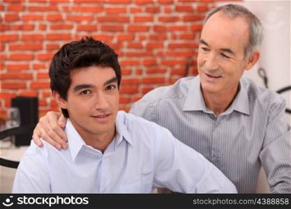 Man supporting his grandson